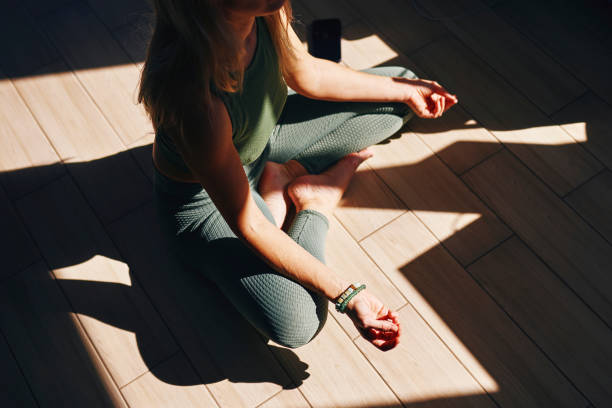 Woman meditating in calm morning light for memory and focus